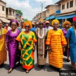 베냉 독립기념일 행사 - A vibrant street scene during Benin&rsquo;s Independence Day celebration showcasing a diverse group of peo...